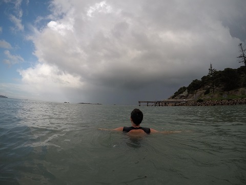 Swimmer treading water with outstretched arms